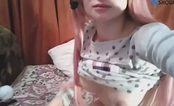 PinkHaired Seductress Teasing with Leg Spread